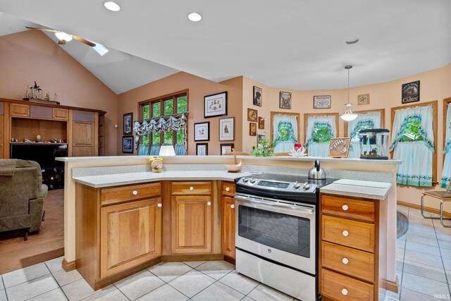 4705 Haven Ct, West Lafayette, IN 47906 - kitchen with stainless steel electric stove, light tile patterned floors, a ceiling fan, light countertops, and vaulted ceiling