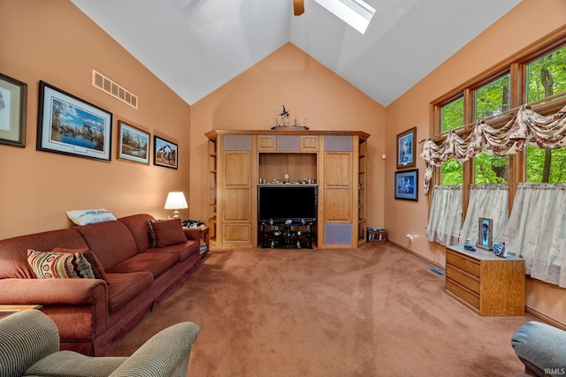 4705 Haven Ct, West Lafayette, IN 47906 - living area with light carpet, high vaulted ceiling, ceiling fan, and a skylight