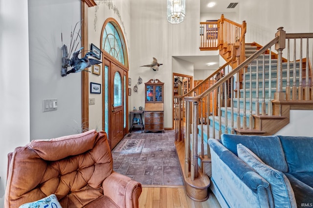 4705 Haven Ct, West Lafayette, IN 47906 - entryway with stairway, wood finished floors, a high ceiling, and baseboards