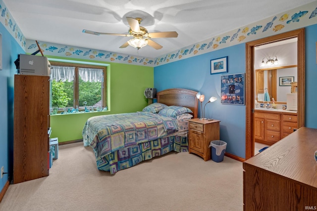 4705 Haven Ct, West Lafayette, IN 47906 - carpeted bedroom with baseboards, ensuite bathroom, and a ceiling fan