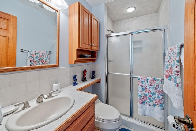 4705 Haven Ct, West Lafayette, IN 47906 - bathroom with a stall shower, vanity, toilet, and backsplash
