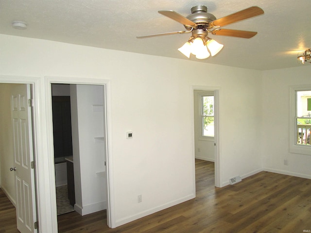 712 Hubbard St, Mishawaka, IN 46544 - unfurnished room with dark wood-style floors, baseboards, ceiling fan, and a smoke detector