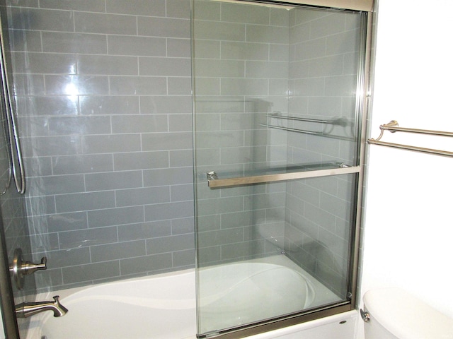 712 Hubbard St, Mishawaka, IN 46544 - bathroom featuring combined bath / shower with glass door and toilet