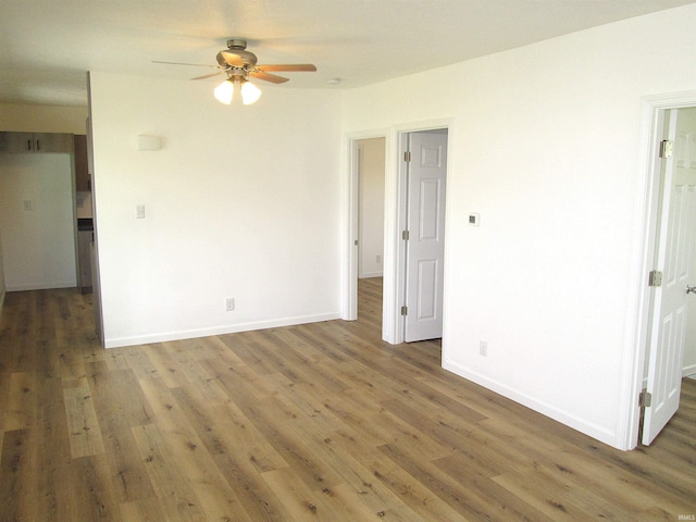 712 Hubbard St, Mishawaka, IN 46544 - empty room featuring a ceiling fan, wood finished floors, and baseboards