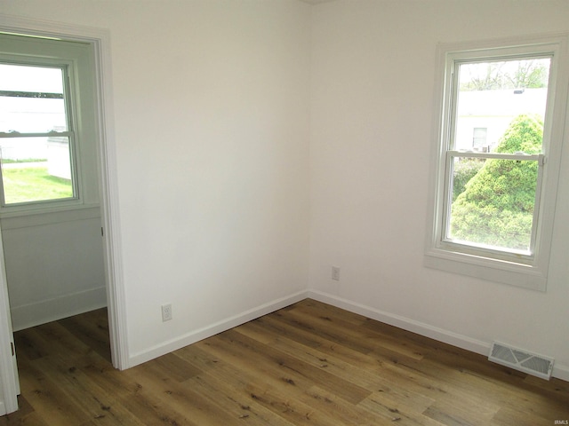 712 Hubbard St, Mishawaka, IN 46544 - spare room featuring plenty of natural light, wood finished floors, and baseboards