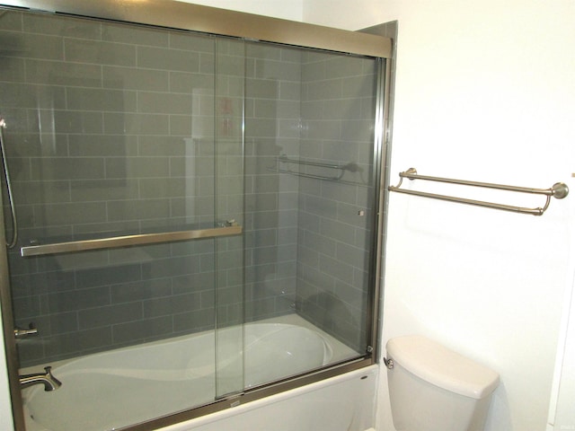 712 Hubbard St, Mishawaka, IN 46544 - bathroom with toilet and bath / shower combo with glass door