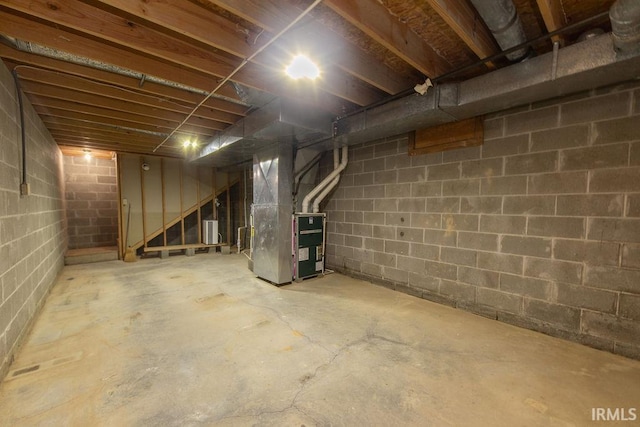 1005 S Carleton Ct, Bloomington, IN 47401 - unfinished below grade area featuring heating unit and stairs