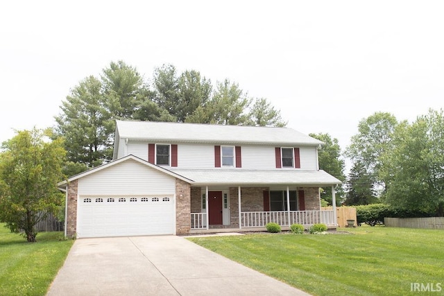 1005 S Carleton Ct, Bloomington, IN 47401 - view of front of home featuring covered porch, an attached garage, concrete driveway, a front yard, and brick siding
