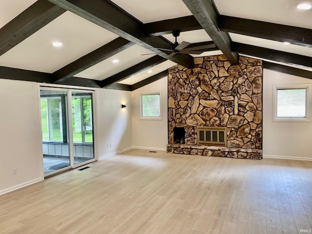 4605 Merriam Park Dr, Fort Wayne, IN 46816 - unfurnished living room with ceiling fan, baseboards, wood finished floors, and a stone fireplace