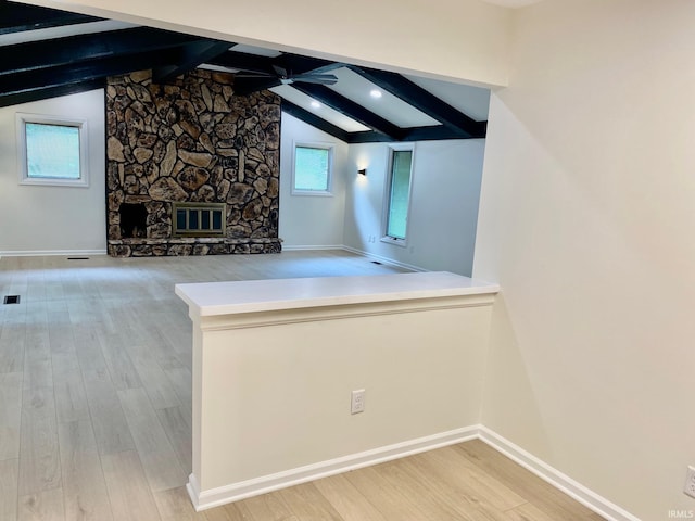 4605 Merriam Park Dr, Fort Wayne, IN 46816 - additional living space with wood finished floors, ceiling fan, a fireplace, and baseboards