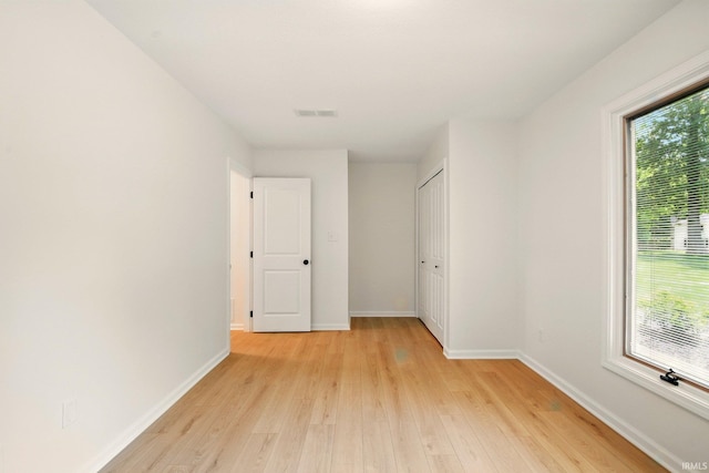 4605 Merriam Park Dr, Fort Wayne, IN 46816 - spare room featuring light wood-style flooring, plenty of natural light, and baseboards