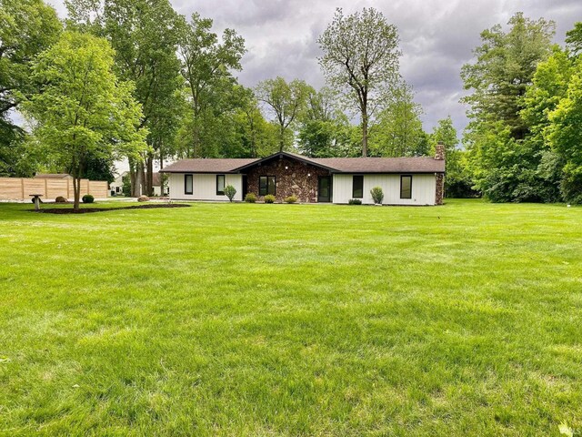 4605 Merriam Park Dr, Fort Wayne, IN 46816 - view of front of home featuring a chimney and a front lawn