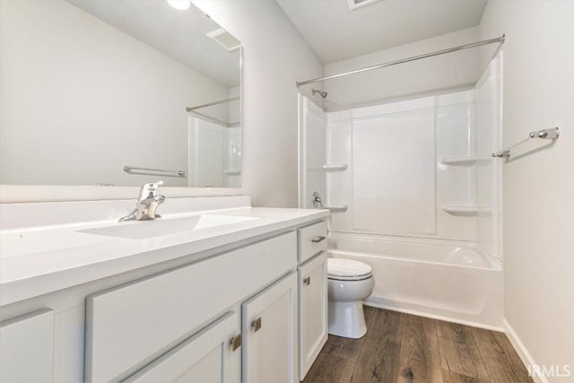 2200 Miami Trl, Huntington, IN 46750 - full bath with wood finished floors, toilet, vanity, tub / shower combination, and baseboards