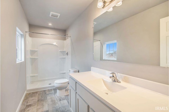 52070 Olympus Pass, Granger, IN 46530 - full bathroom with toilet, a shower, vanity, and wood finished floors