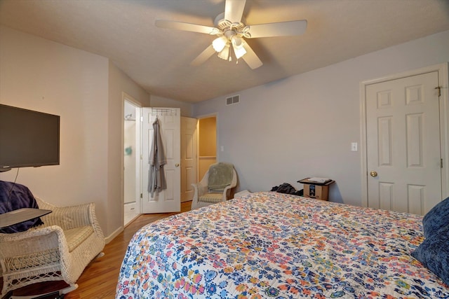 3491 S Oaklawn Cir, Bloomington, IN 47401 - bedroom featuring wood finished floors, a ceiling fan, and baseboards