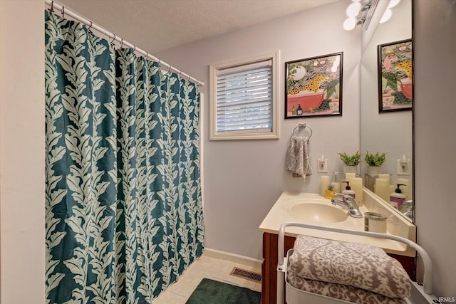 3491 S Oaklawn Cir, Bloomington, IN 47401 - bathroom featuring tile patterned flooring, vanity, a textured ceiling, and curtained shower
