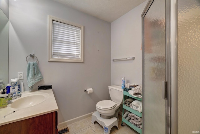 3491 S Oaklawn Cir, Bloomington, IN 47401 - full bath with toilet, tile patterned flooring, a stall shower, vanity, and baseboards