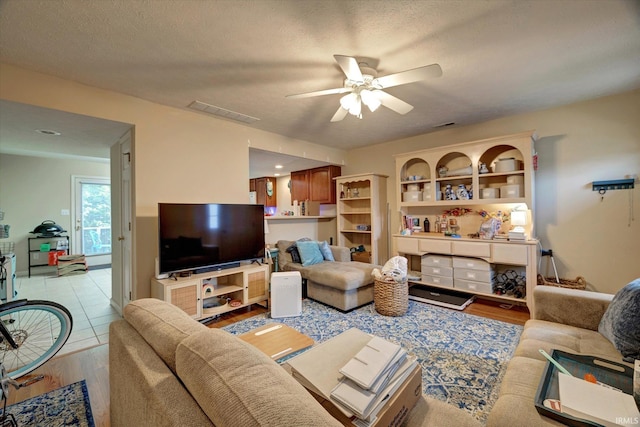 3491 S Oaklawn Cir, Bloomington, IN 47401 - living room with ceiling fan and light wood-style floors