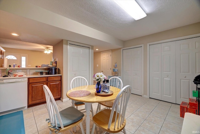 3491 S Oaklawn Cir, Bloomington, IN 47401 - dining area with light tile patterned floors, a textured ceiling, recessed lighting, and baseboards
