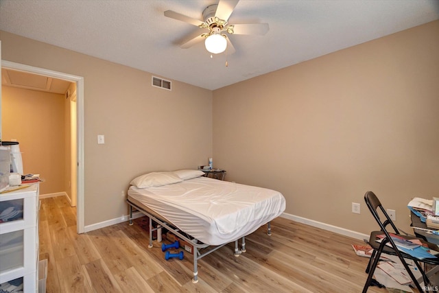 3425 S Oaklawn Cir, Bloomington, IN 47401 - bedroom featuring light wood finished floors, baseboards, and ceiling fan