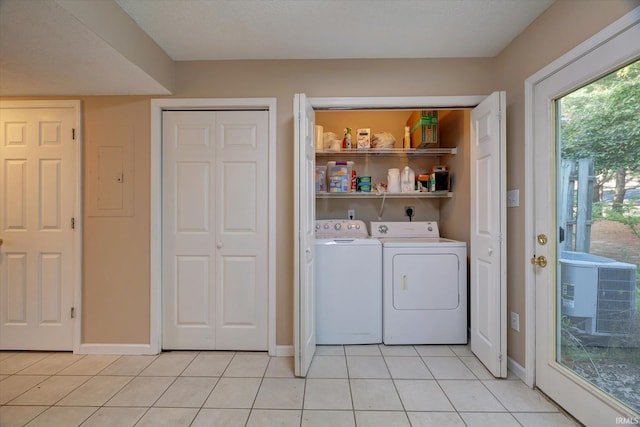 3425 S Oaklawn Cir, Bloomington, IN 47401 - washroom with light tile patterned flooring, separate washer and dryer, and baseboards