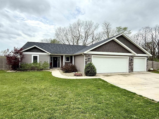 310 Main St, Lagro, IN 46941 - view of front facade featuring an attached garage, concrete driveway, stone siding, and a shingled roof