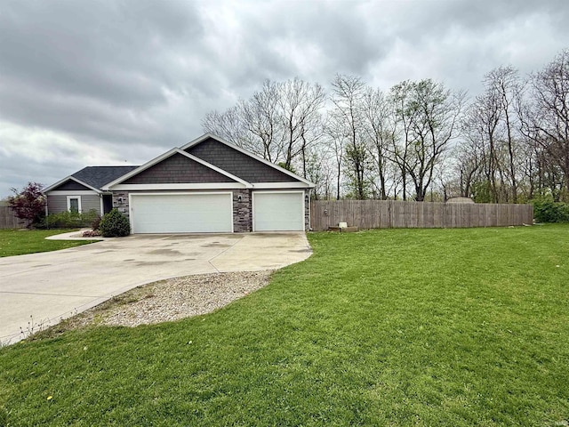 310 Main St, Lagro, IN 46941 - view of yard featuring concrete driveway and an attached garage