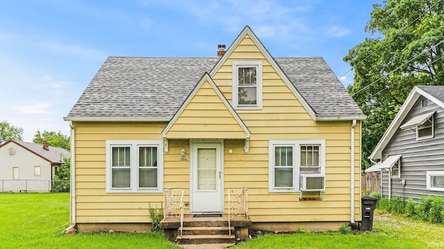 5916 S Harrison St, Fort Wayne, IN 46807 - view of front of house with roof with shingles, a chimney, and cooling unit