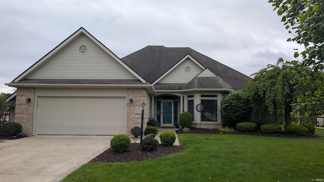 5728 Bell Tower Ln, Fort Wayne, IN 46815 - traditional-style house featuring concrete driveway, a front yard, an attached garage, and brick siding