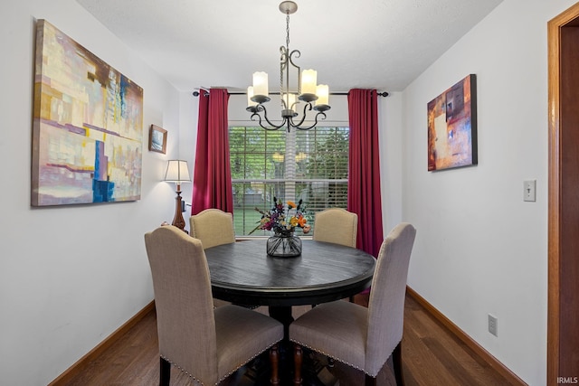 821 Lagrange St, West Lafayette, IN 47906 - dining room featuring a chandelier, dark wood finished floors, and baseboards