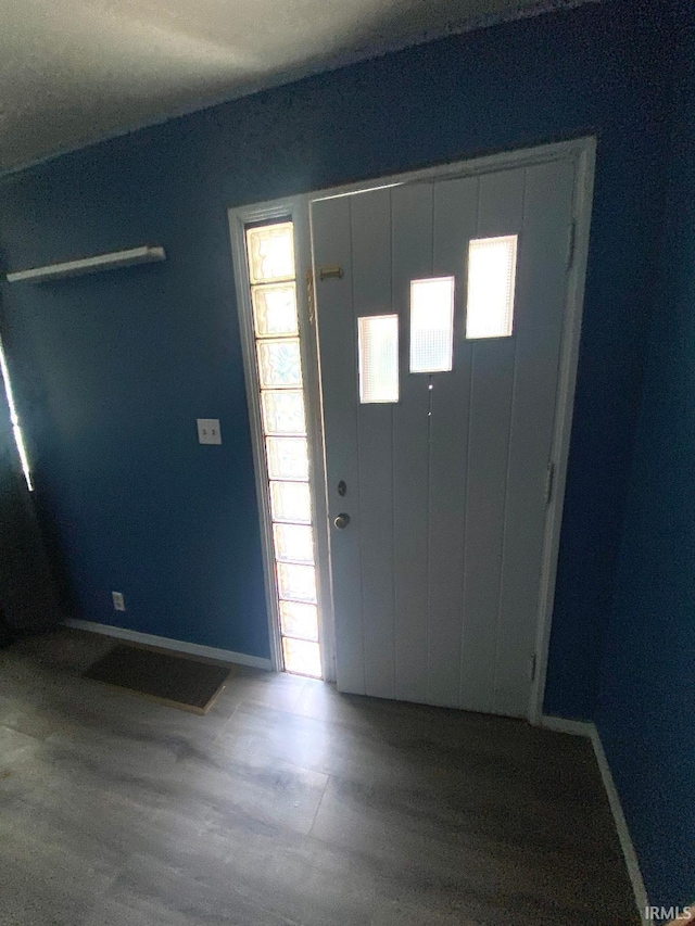 589 2nd St NW, Linton, IN 47441 - foyer featuring baseboards and wood finished floors