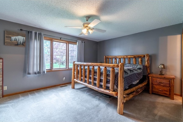 705 Pine Run, Angola, IN 46703 - carpeted bedroom with a textured ceiling, baseboards, and a ceiling fan