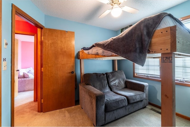 705 Pine Run, Angola, IN 46703 - bedroom featuring carpet floors, a ceiling fan, and a textured ceiling