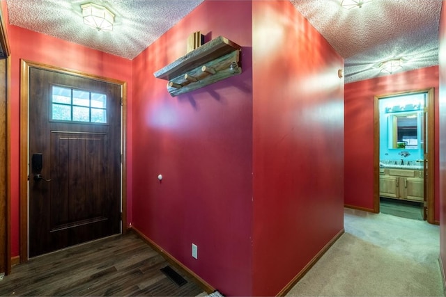 705 Pine Run, Angola, IN 46703 - foyer featuring a textured ceiling and baseboards
