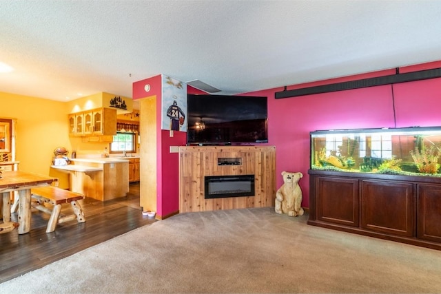 705 Pine Run, Angola, IN 46703 - living area featuring carpet and a glass covered fireplace
