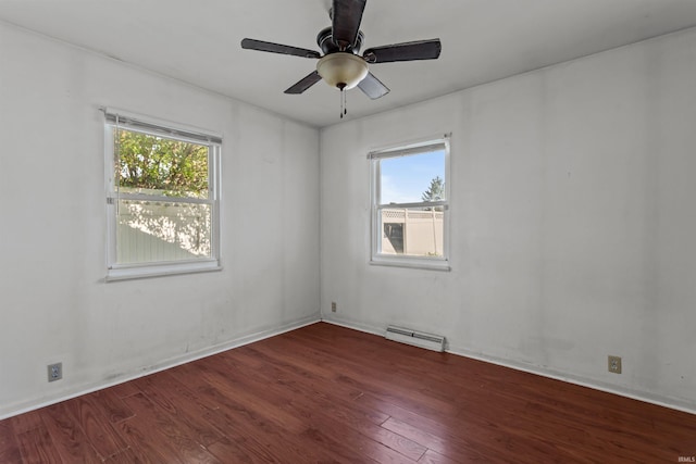 1725 W Saxon Dr, Marion, IN 46952 - spare room with baseboard heating, wood finished floors, a ceiling fan, and baseboards