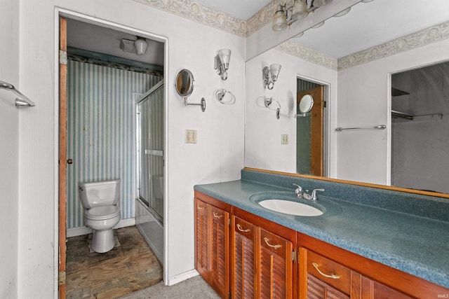 1725 W Saxon Dr, Marion, IN 46952 - full bath with toilet, vanity, and shower / bath combination with glass door