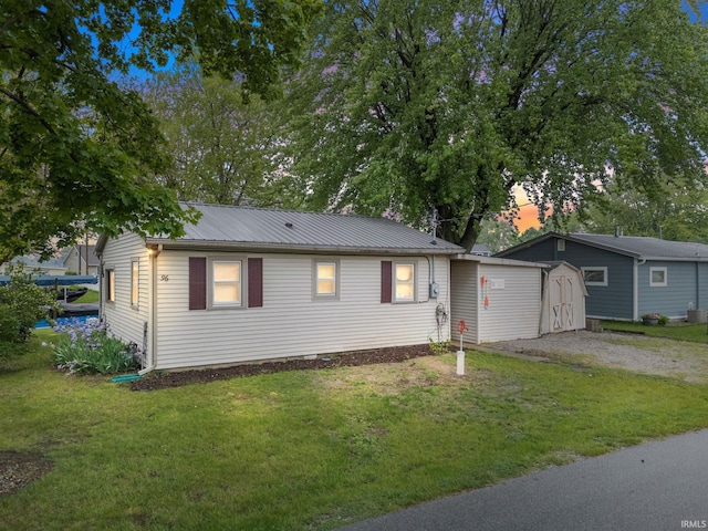 96 Ems B61I Ln, Warsaw, IN 46582 - single story home featuring a lawn, metal roof, and gravel driveway