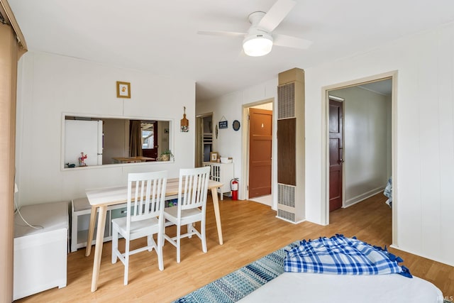 96 Ems B61I Ln, Warsaw, IN 46582 - dining area featuring a heating unit, wood finished floors, and a ceiling fan