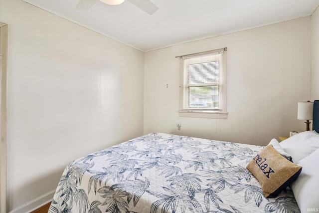 96 Ems B61I Ln, Warsaw, IN 46582 - bedroom with ornamental molding, a ceiling fan, and baseboards