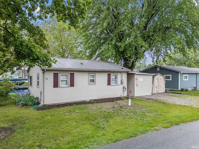 96 Ems B61I Ln, Warsaw, IN 46582 - view of front of house featuring a front lawn, metal roof, and dirt driveway