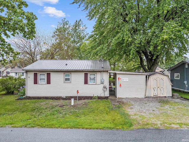 96 Ems B61I Ln, Warsaw, IN 46582 - view of front of home with a front yard and metal roof