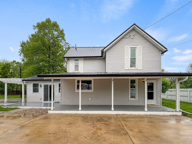 9931 Aboite Center Rd, Fort Wayne, IN 46804 - view of front of property featuring a pergola, metal roof, a porch, and a patio