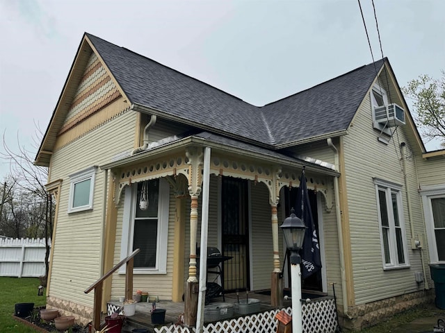 417 S Elliott St, Muncie, IN 47305 - view of front of home with a porch, roof with shingles, and cooling unit