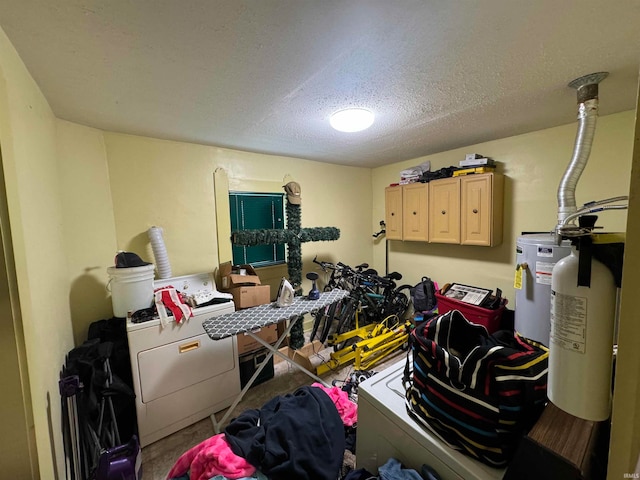 417 S Elliott St, Muncie, IN 47305 - storage area featuring water heater and independent washer and dryer