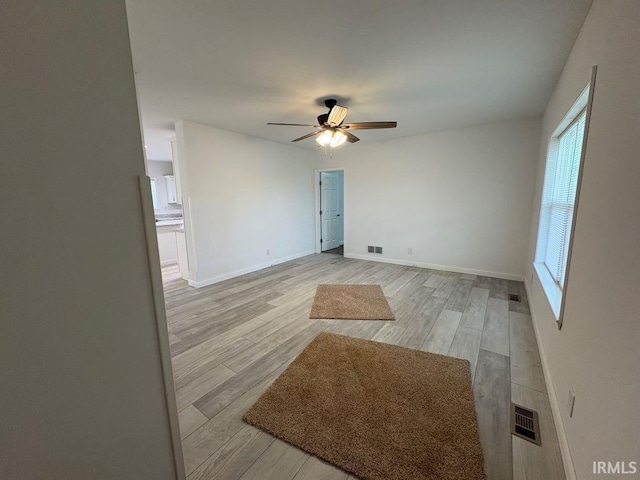 844 Ben Franklin St, Cloverdale, IN 46120 - spare room featuring a ceiling fan, light wood-style floors, and baseboards