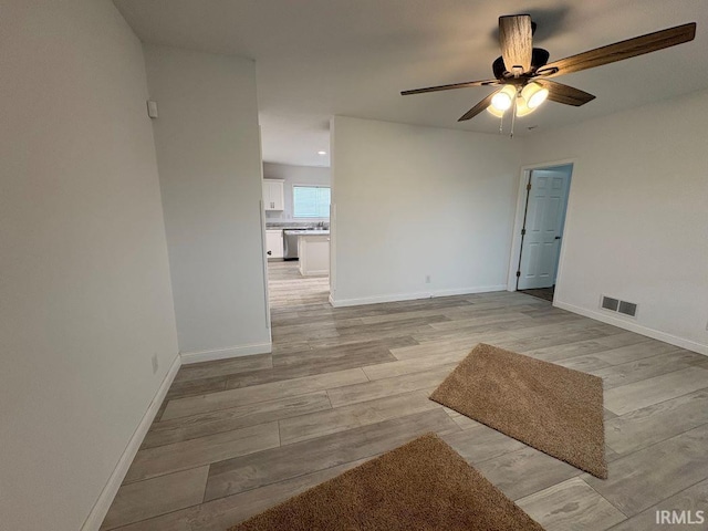 844 Ben Franklin St, Cloverdale, IN 46120 - spare room featuring a ceiling fan, light wood finished floors, and baseboards