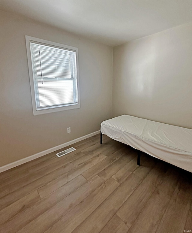 402 Sheridan St, Loogootee, IN 47553 - bedroom with wood finished floors and baseboards