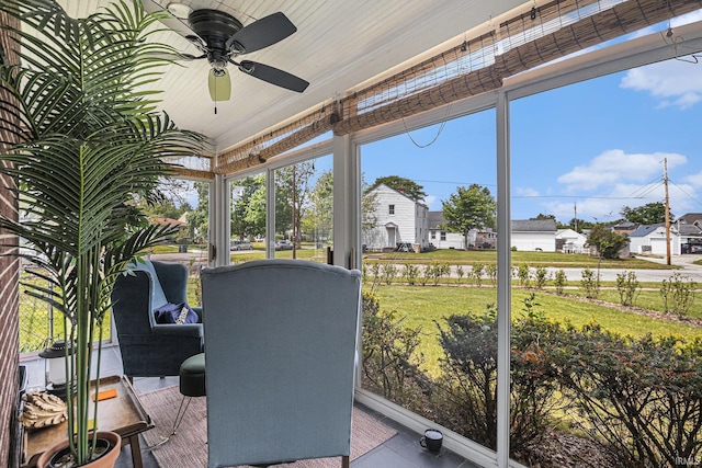 1919 Kessler Blvd, South Bend, IN 46616 - sunroom with a ceiling fan and a residential view