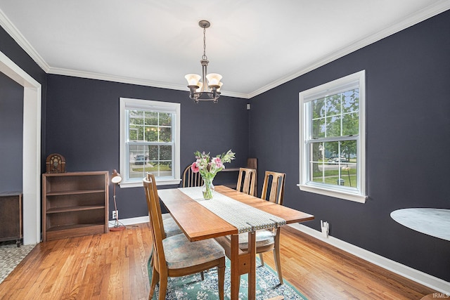 1919 Kessler Blvd, South Bend, IN 46616 - dining space with light wood finished floors, a chandelier, baseboards, and crown molding